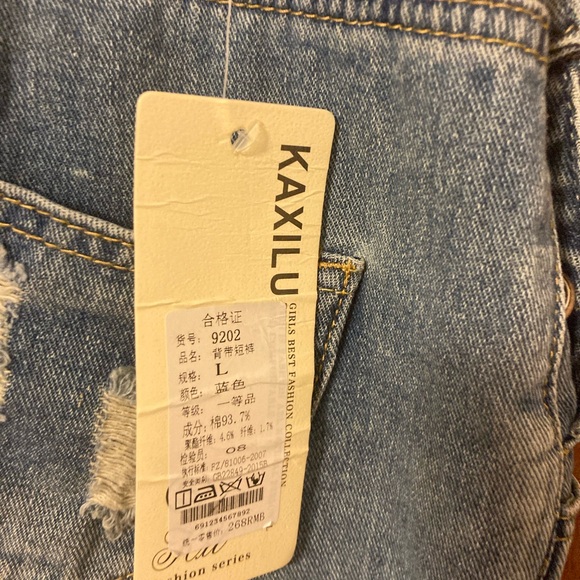 Girls Jean short overalls. Distressed with adjustable straps and stud buttons - Picture 5 of 9